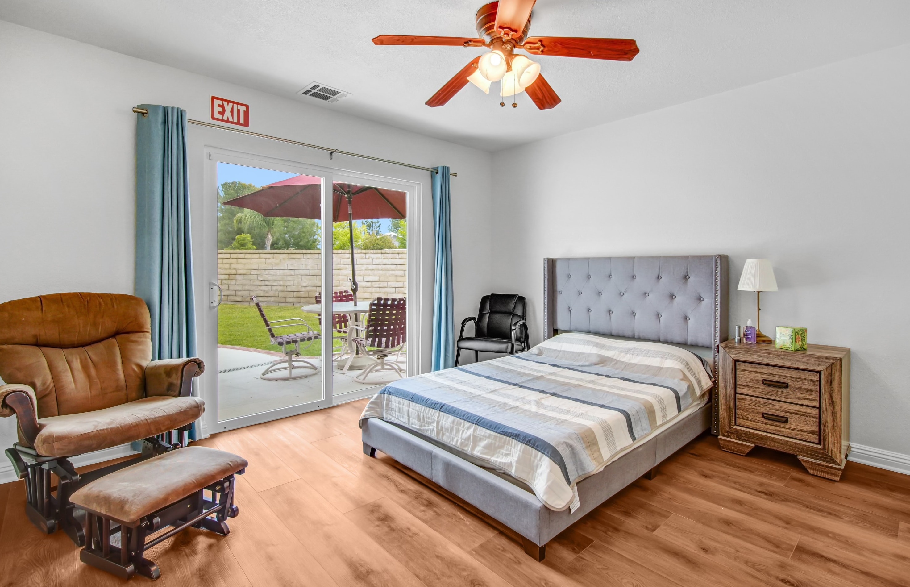 Private bedroom with direct patio access and rocking chair
